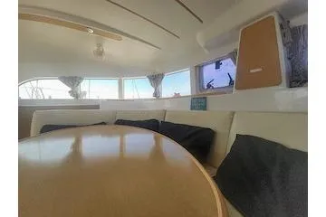 Buzio Yacht Photos Pics Interior of 2014 Lagoon 380 S2 catamaran with cozy seating and large windows.