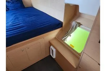 Buzio Yacht Photos Pics Interior cabin of 2014 Lagoon 380 S2 with bed and window view.