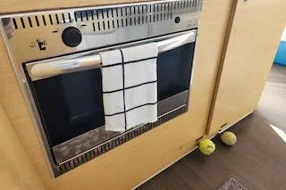 Buzio Yacht Photos Pics Built-in oven with towel in Lagoon 380 S2, 2014 model yacht interior.