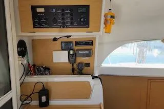 Buzio Yacht Photos Pics Control panel inside 2014 Lagoon 380 S2 catamaran, featuring navigation and communication equipment.