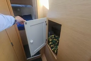 Buzio Yacht Photos Pics Interior of 2014 Lagoon 380 S2 yacht with open storage compartment.