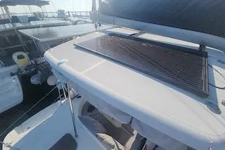 Buzio Yacht Photos Pics 2014 Lagoon 380 S2 catamaran with solar panel on deck, docked at marina.