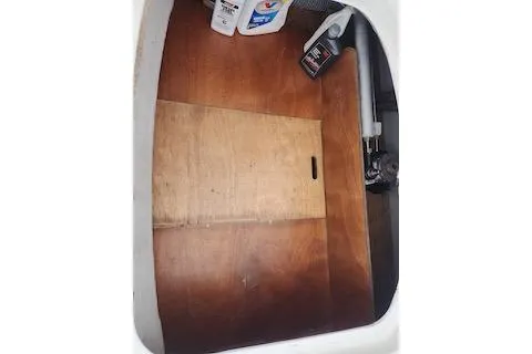 Buzio Yacht Photos Pics Storage compartment of 2014 Lagoon 380 S2 with cleaning supplies and tools.