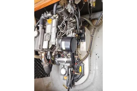 Buzio Yacht Photos Pics Engine compartment of a 2014 Lagoon 380 S2 catamaran, showcasing mechanical components.