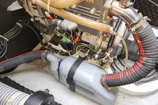 Buzio Yacht Photos Pics Engine compartment of a 2014 Lagoon 380 S2 catamaran, showcasing mechanical components.