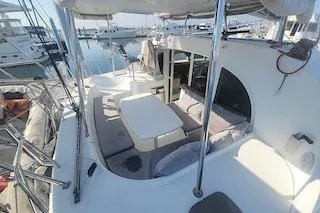 Buzio Yacht Photos Pics 2014 Lagoon 380 S2 catamaran with spacious deck and seating area in marina.