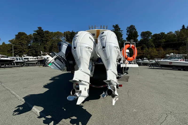  Yacht Photos Pics 2017 Cutwater C-302 Sport Coupe with dual Yamaha outboard engines in a marina setting.
