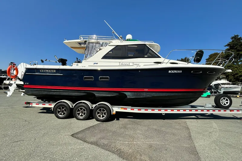  Yacht Photos Pics 2017 Cutwater C-302 Sport Coupe boat on trailer, side view, sunny day.