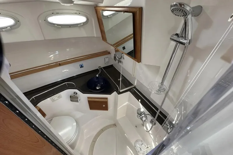  Yacht Photos Pics 2017 Cutwater C-302 Sport Coupe bathroom with shower, sink, and toilet.
