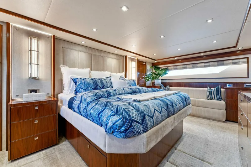 Aussie Rules Yacht Photos Pics Luxurious bedroom interior of 2017 Viking 92 Enclosed Bridge yacht with elegant decor.