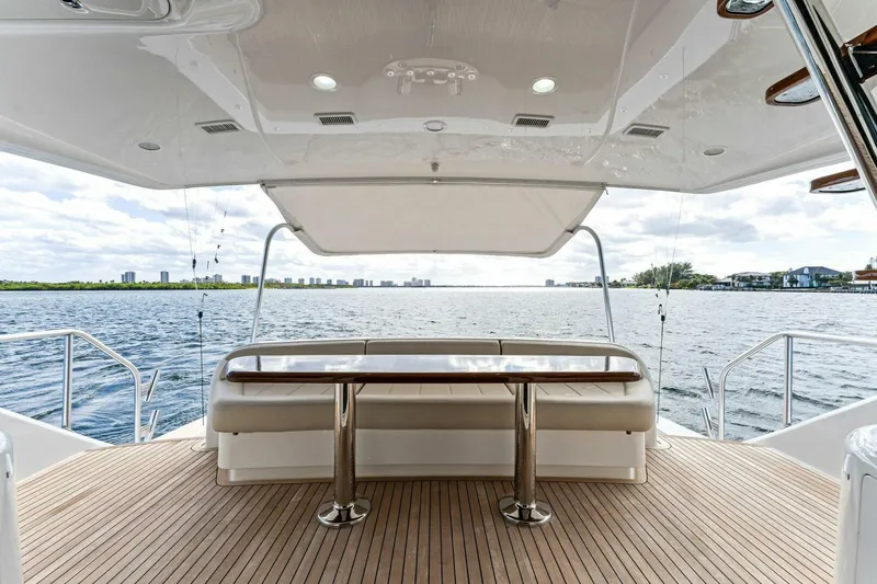 Aussie Rules Yacht Photos Pics Luxurious 2017 Viking 92 Enclosed Bridge yacht with spacious deck and scenic water view.