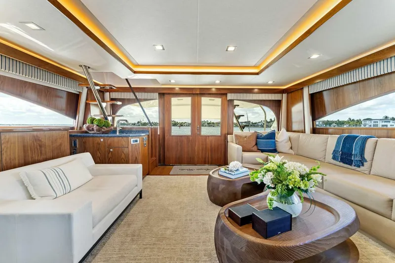 Aussie Rules Yacht Photos Pics Luxurious interior of 2017 Viking 92 Enclosed Bridge yacht with elegant seating and decor.