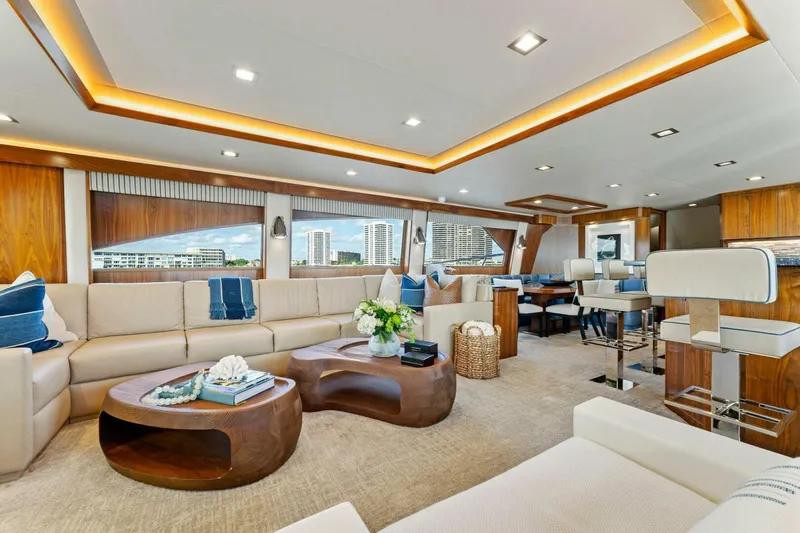 Aussie Rules Yacht Photos Pics Luxurious interior of 2017 Viking 92 Enclosed Bridge yacht with modern furnishings.
