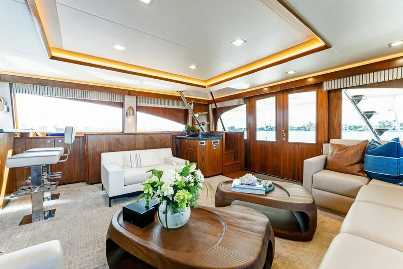Aussie Rules Yacht Photos Pics Luxurious interior of 2017 Viking 92 Enclosed Bridge yacht with elegant seating and decor.