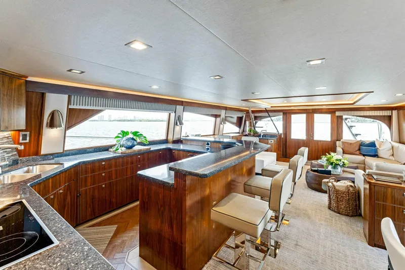 Aussie Rules Yacht Photos Pics Luxurious interior of 2017 Viking 92 Enclosed Bridge yacht with modern furnishings.