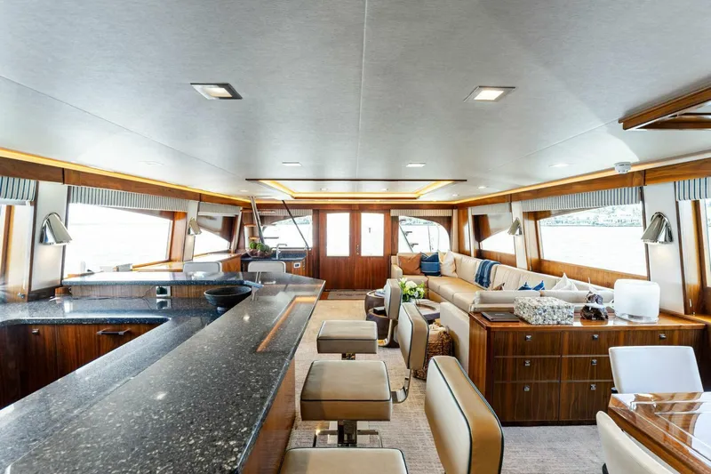 Aussie Rules Yacht Photos Pics Luxurious interior of 2017 Viking 92 Enclosed Bridge yacht with modern furnishings.