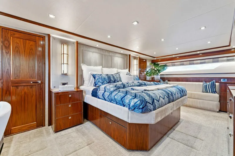 Aussie Rules Yacht Photos Pics Luxurious bedroom interior of 2017 Viking 92 Enclosed Bridge yacht.