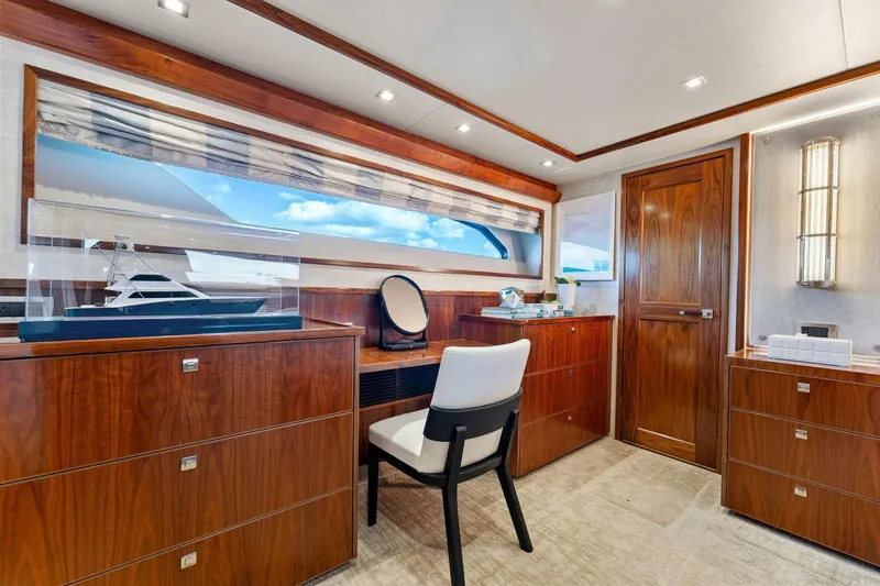 Aussie Rules Yacht Photos Pics Luxurious interior of 2017 Viking 92 Enclosed Bridge yacht with elegant wood finishes.