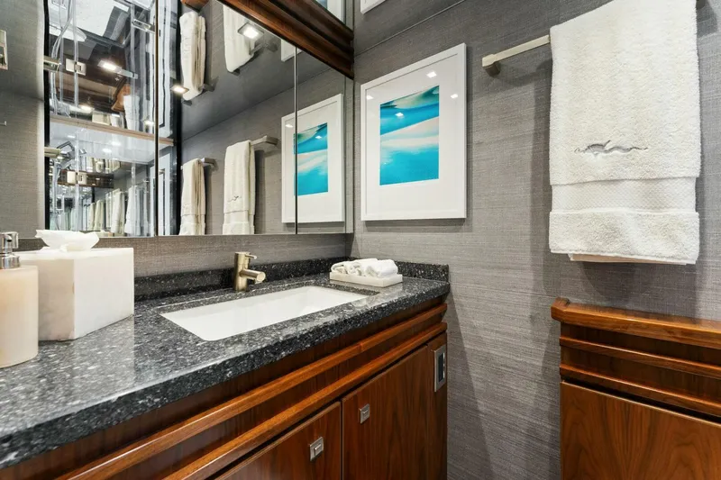 Aussie Rules Yacht Photos Pics Luxurious bathroom in 2017 Viking 92 Enclosed Bridge yacht with modern fixtures and elegant decor.