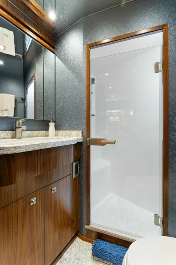 Aussie Rules Yacht Photos Pics Luxurious bathroom in 2017 Viking 92 Enclosed Bridge yacht with modern fixtures.