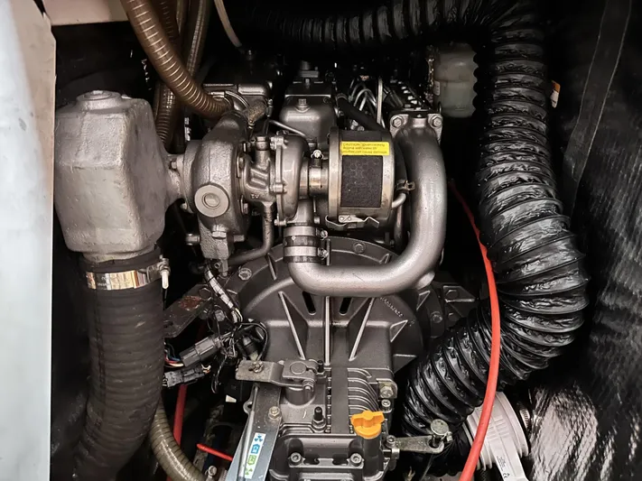 Blue Yacht Photos Pics Engine compartment of a 2006 Hanse 461 sailboat, showcasing intricate mechanical components.