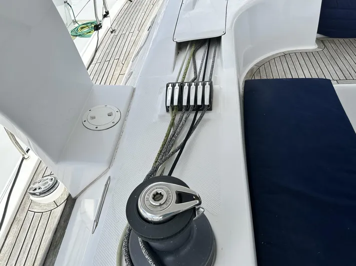 Blue Yacht Photos Pics Deck of 2006 Hanse 461 sailboat with winch and rope clutches.