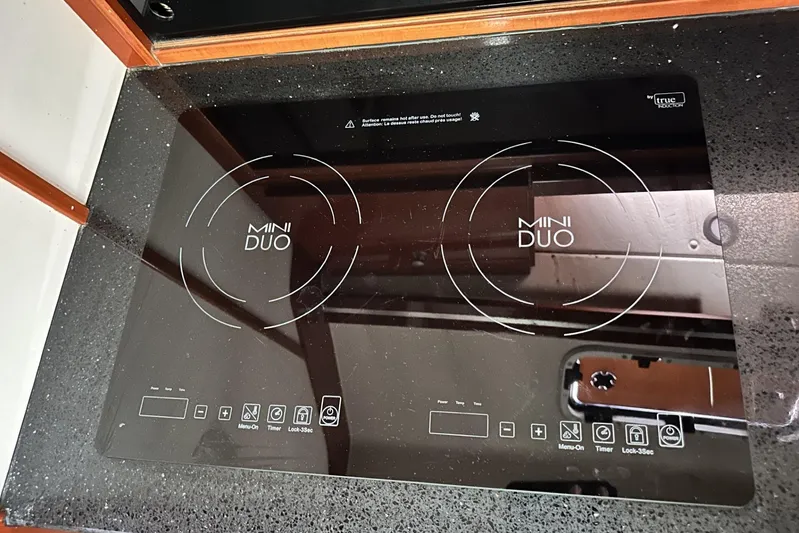 Blue Yacht Photos Pics Induction cooktop on 2006 Hanse 461 yacht kitchen counter.