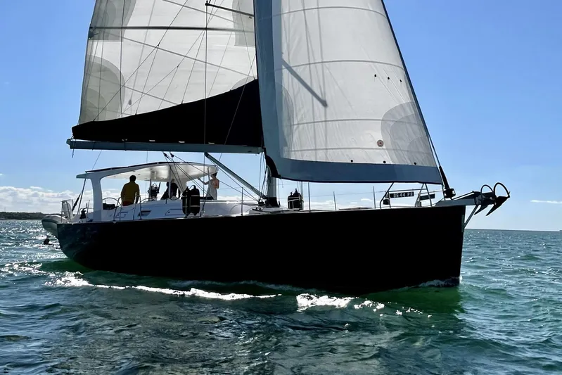 Blue Yacht Photos Pics Sailing yacht Hanse 461, 2006 model, gliding on open water under clear skies.