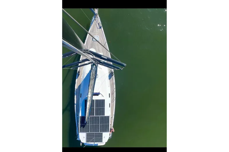 Blue Yacht Photos Pics Aerial view of 2006 Hanse 461 sailboat with solar panels on deck.