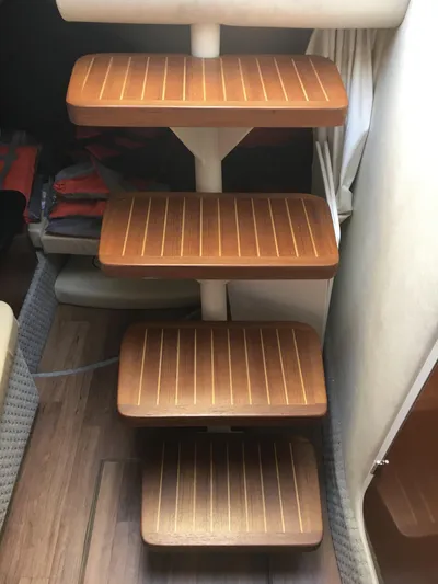  Yacht Photos Pics Wooden steps inside a 2010 Sea Ray 330 Sundancer boat cabin.