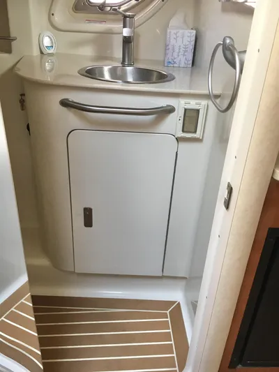  Yacht Photos Pics 2010 Sea Ray 330 Sundancer bathroom with sink, cabinet, and modern fixtures.