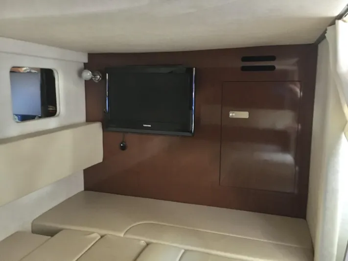  Yacht Photos Pics Interior cabin of 2010 Sea Ray 330 Sundancer with TV and seating area.