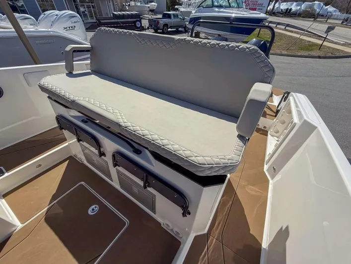  Yacht Photos Pics 2025 Navan S30 boat with cushioned seating and storage compartments.