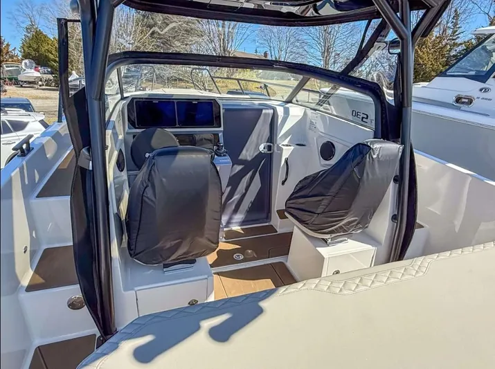  Yacht Photos Pics Interior view of 2025 Navan S30 boat, featuring modern seating and navigation equipment.