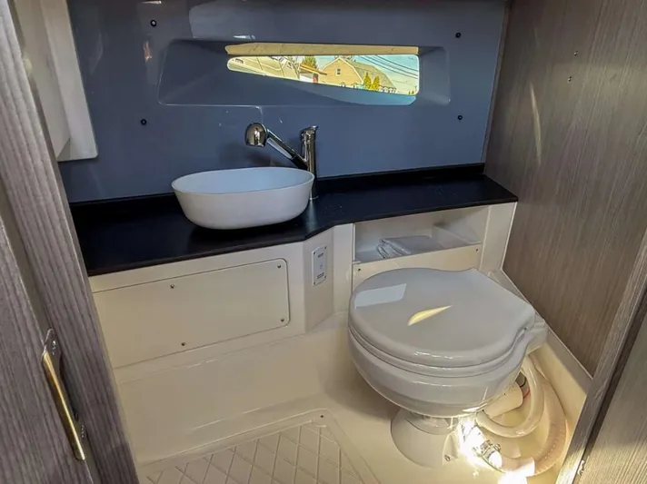  Yacht Photos Pics Modern bathroom in 2025 Navan S30 with sleek sink and compact toilet design.