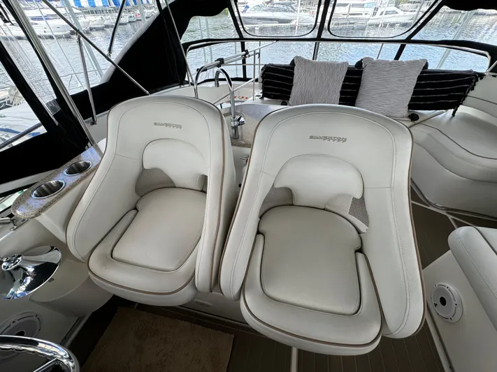 Seas The Reins Yacht Photos Pics 2006 Silverton 43 Sport Bridge interior with plush seating and modern design.