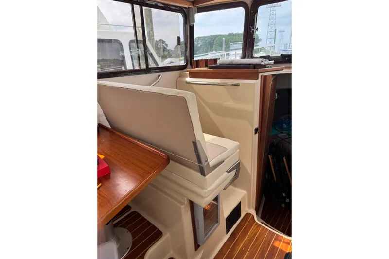 Lady Mary Yacht Photos Pics 2009 Ranger Tugs R-29 interior with seating and wooden accents.