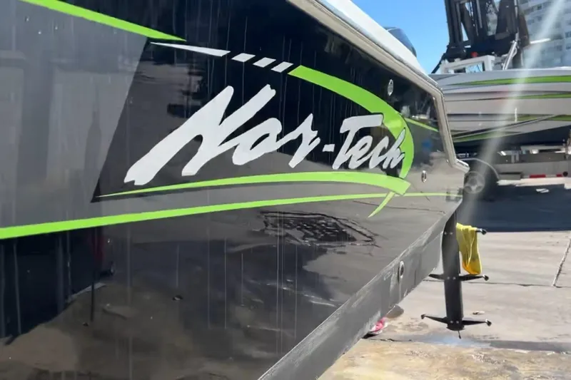  Yacht Photos Pics 2014 Nor-Tech 390 Sport Cuddy Center Console boat with sleek design and vibrant graphics.