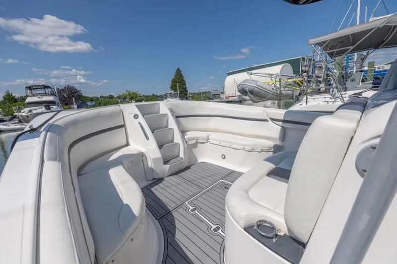  Yacht Photos Pics 2014 Nor-Tech 390 Sport Cuddy Center Console boat interior with white seating and gray flooring.