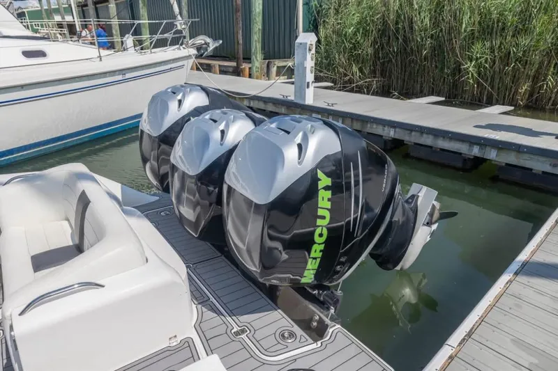  Yacht Photos Pics 2014 Nor-Tech 390 Sport Cuddy Center Console with triple Mercury outboard engines at dock.