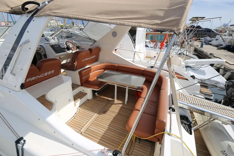  Yacht Photos Pics Luxury 1993 Princess 366 Riviera yacht with elegant seating and modern dashboard.