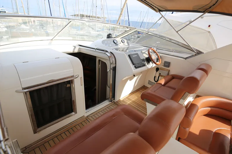  Yacht Photos Pics Luxurious 1993 Princess 366 Riviera yacht interior with leather seating and modern helm.