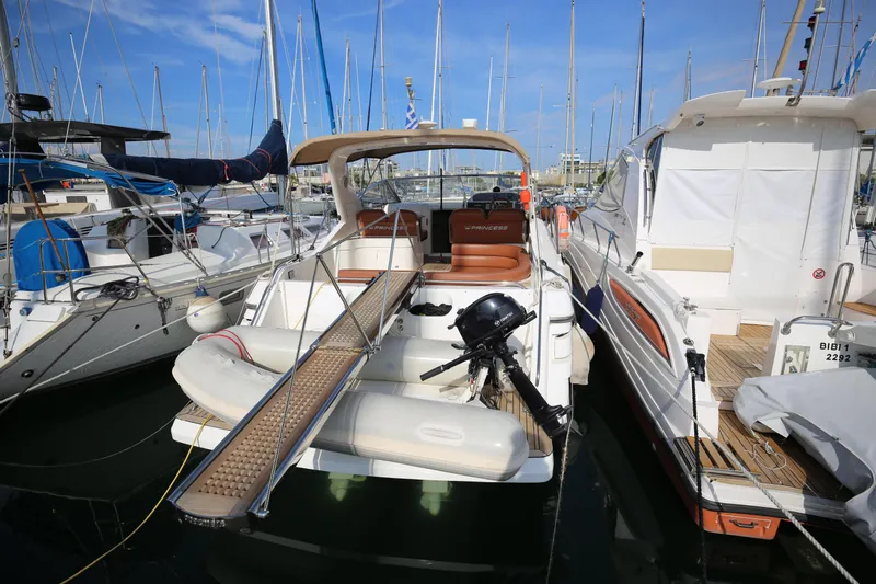  Yacht Photos Pics 1993 Princess 366 Riviera yacht docked at marina, surrounded by sailboats.