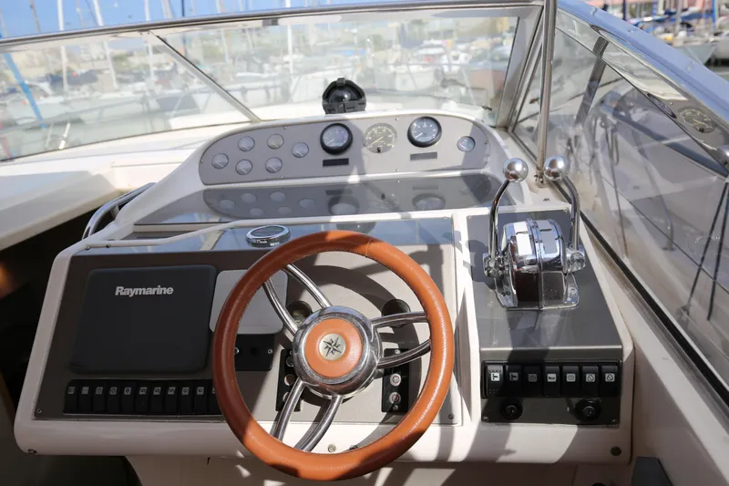  Yacht Photos Pics Cockpit of 1993 Princess 366 Riviera yacht with steering wheel and control panel.