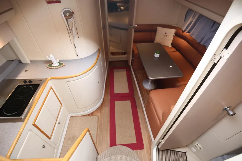  Yacht Photos Pics Interior of 1993 Princess 366 Riviera yacht with kitchen and cozy seating area.