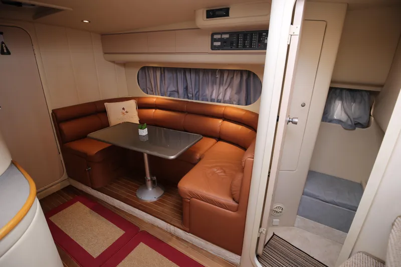  Yacht Photos Pics Interior of 1993 Princess 366 Riviera yacht with leather seating and dining area.