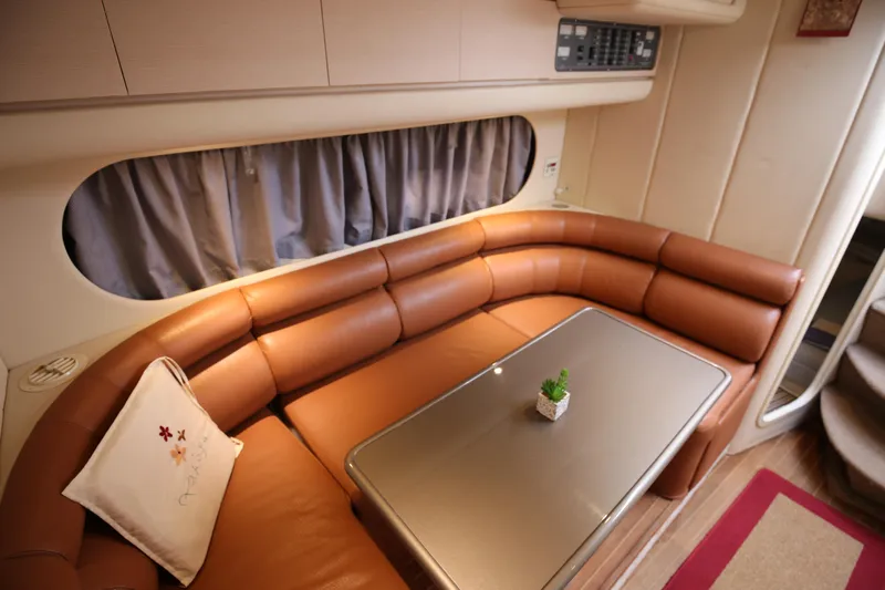  Yacht Photos Pics Luxurious interior of 1993 Princess 366 Riviera yacht with leather seating and elegant table.