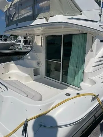  Yacht Photos Pics 2003 Sea Ray 400 Sedan Bridge yacht with spacious deck and sliding glass doors.