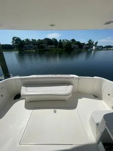  Yacht Photos Pics 2003 Sea Ray 400 Sedan Bridge yacht with spacious deck overlooking serene waterfront.