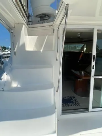  Yacht Photos Pics Staircase and entrance of 2003 Sea Ray 400 Sedan Bridge yacht, showcasing sleek design.